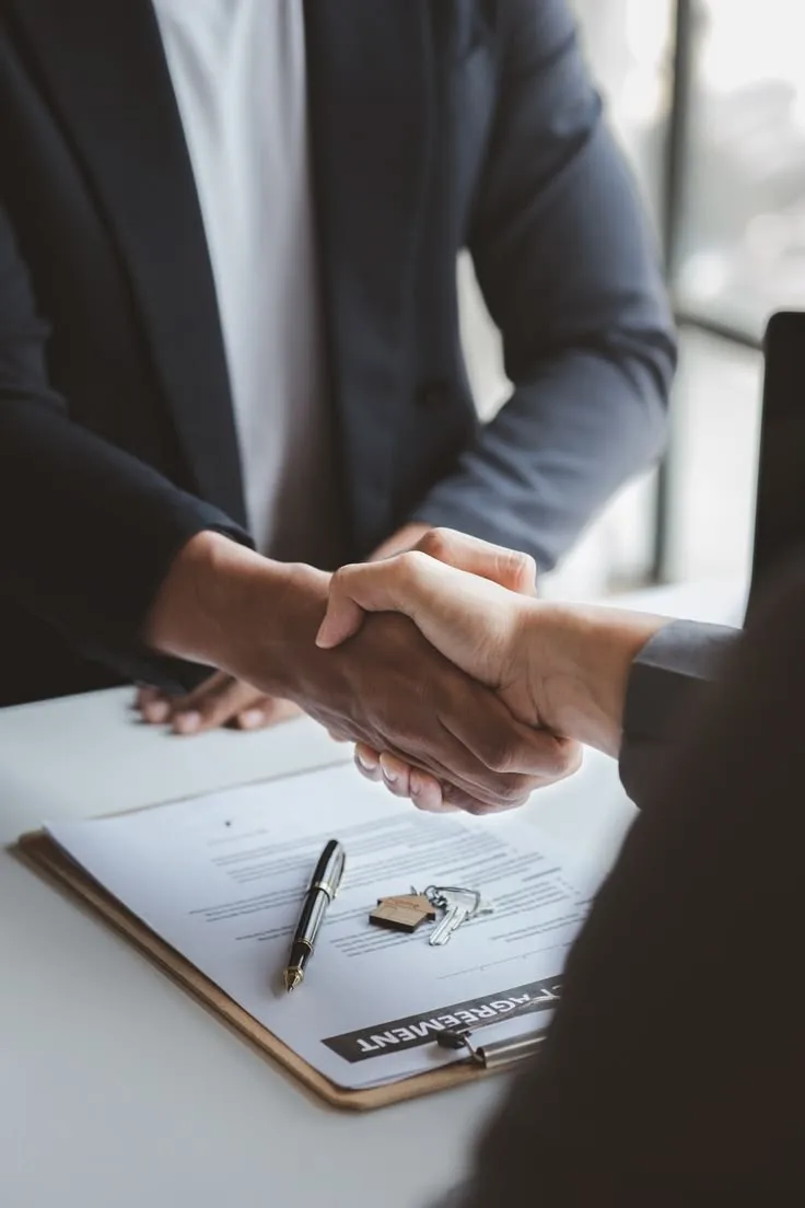 Two professionals confirm a partnership agreement.